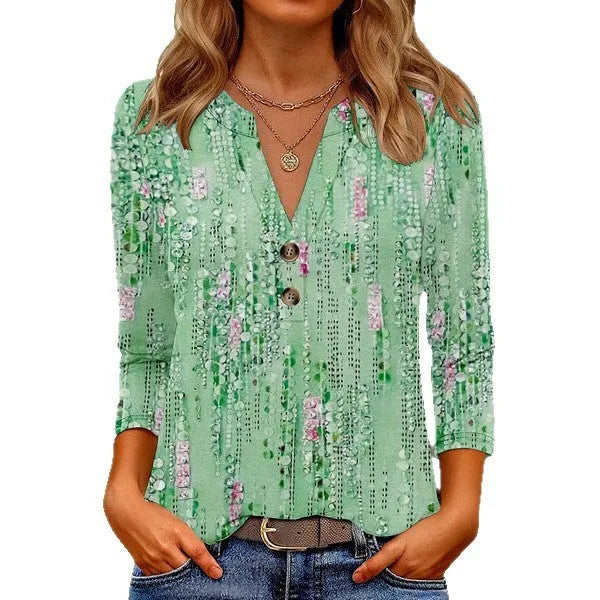 Women's loose-fit grey V-neck t-shirt with a white 3D geometric pattern print on the front.