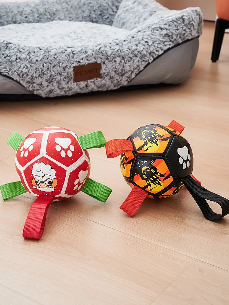 Dog soccer ball toy with straps in Christmas and Halloween colours for tug of war and water play