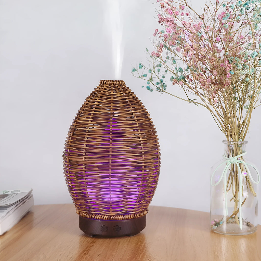 Hollow rattan aroma diffuser with light wood grain base and 100ml capacity for essential oils