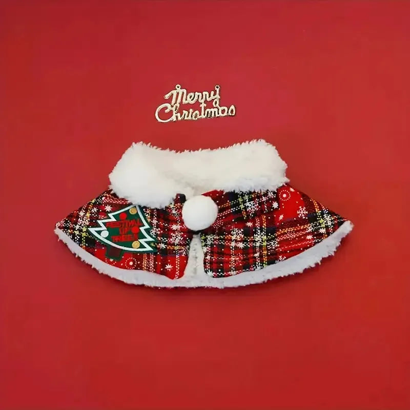 Red festive dog scarf with bell pattern fastened around a small dog's neck in winter.
