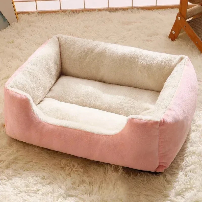 Soft grey short plush cat bed for a sleeping kitten