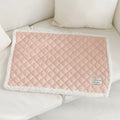 Blue quilted terry cloth cat blanket shown in a pet bed.