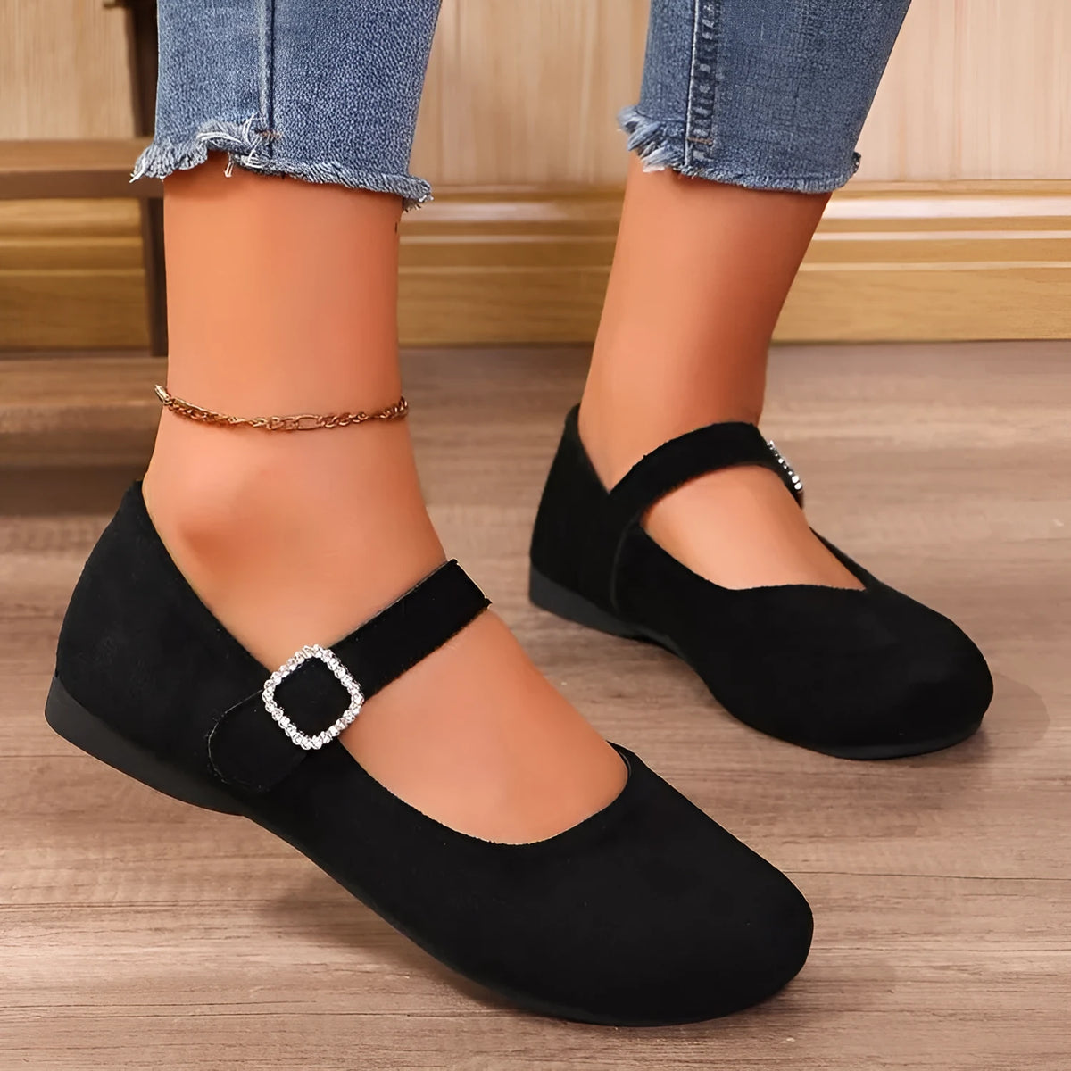 A pair of black men's canvas fisherman flat shoes with a rubber sole on a white background.