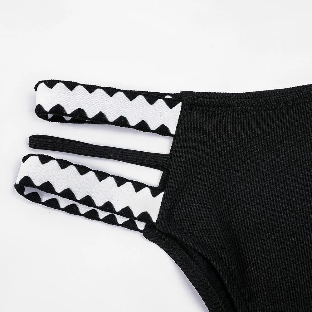 Black women's one-piece swimsuit with hollowed-out split briefs design
