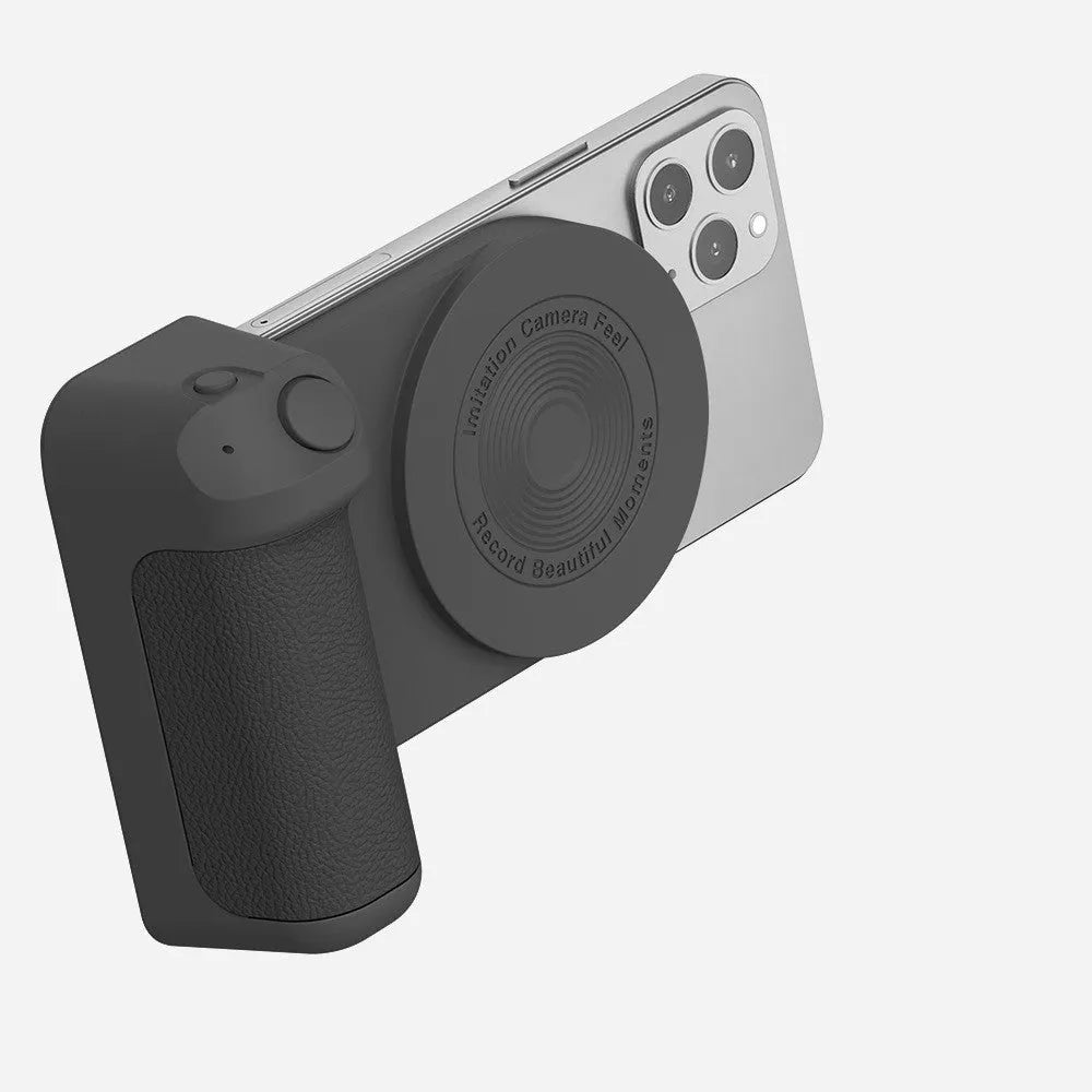 Black multifunctional phone camera holder with magnetic suction and rotatable stand on a table.