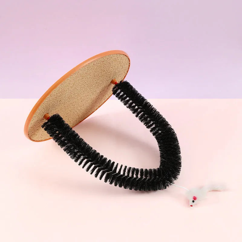Black plastic arch-shaped cat grooming brush and scratching post with attached mouse toy
