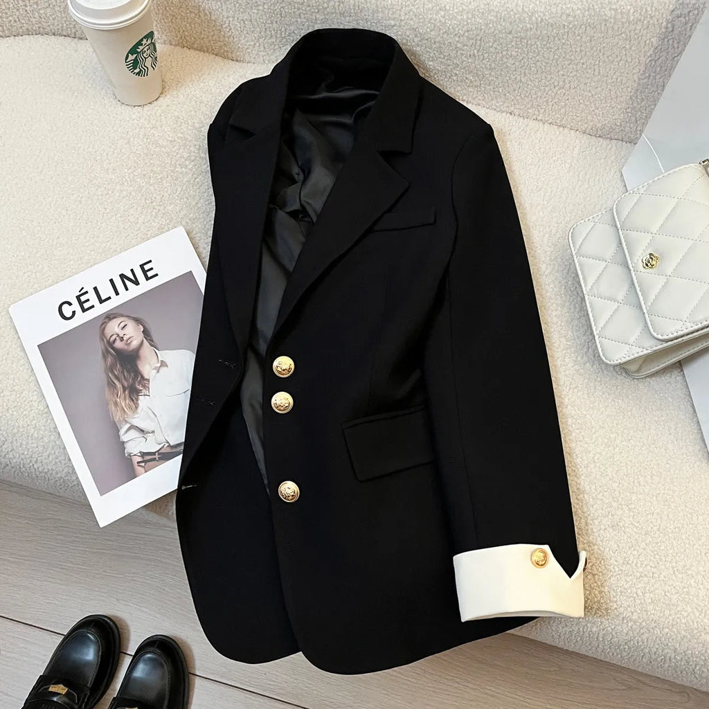 Korean-style loose fit women's coat in milky white, showing long sleeves and pockets.