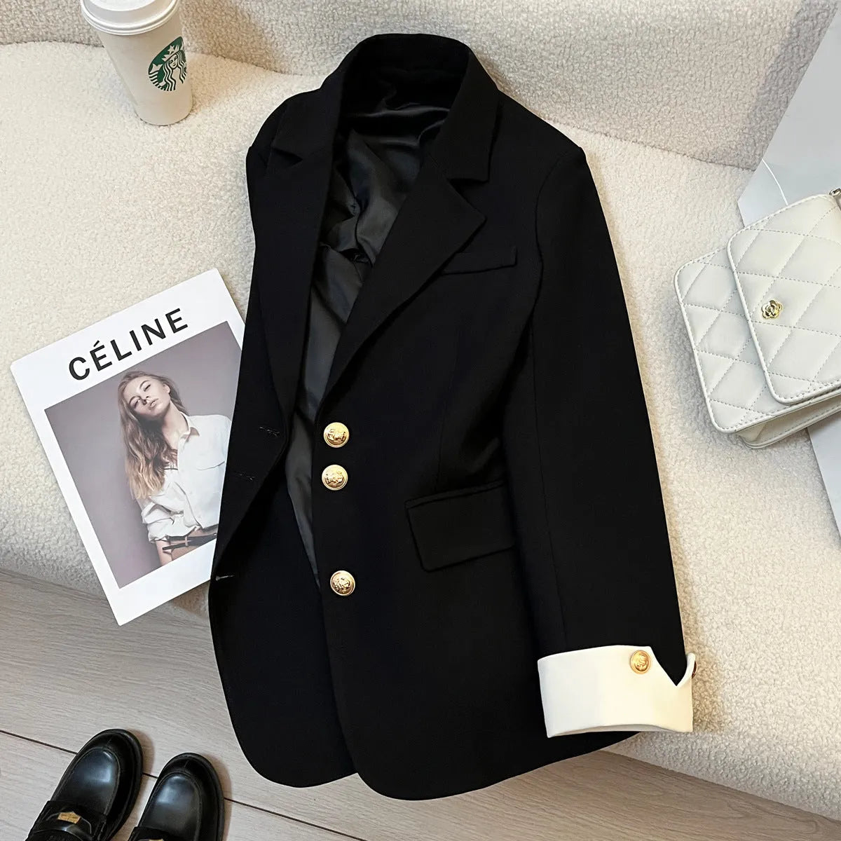 Korean-style loose fit women's coat in milky white, showing long sleeves and pockets.