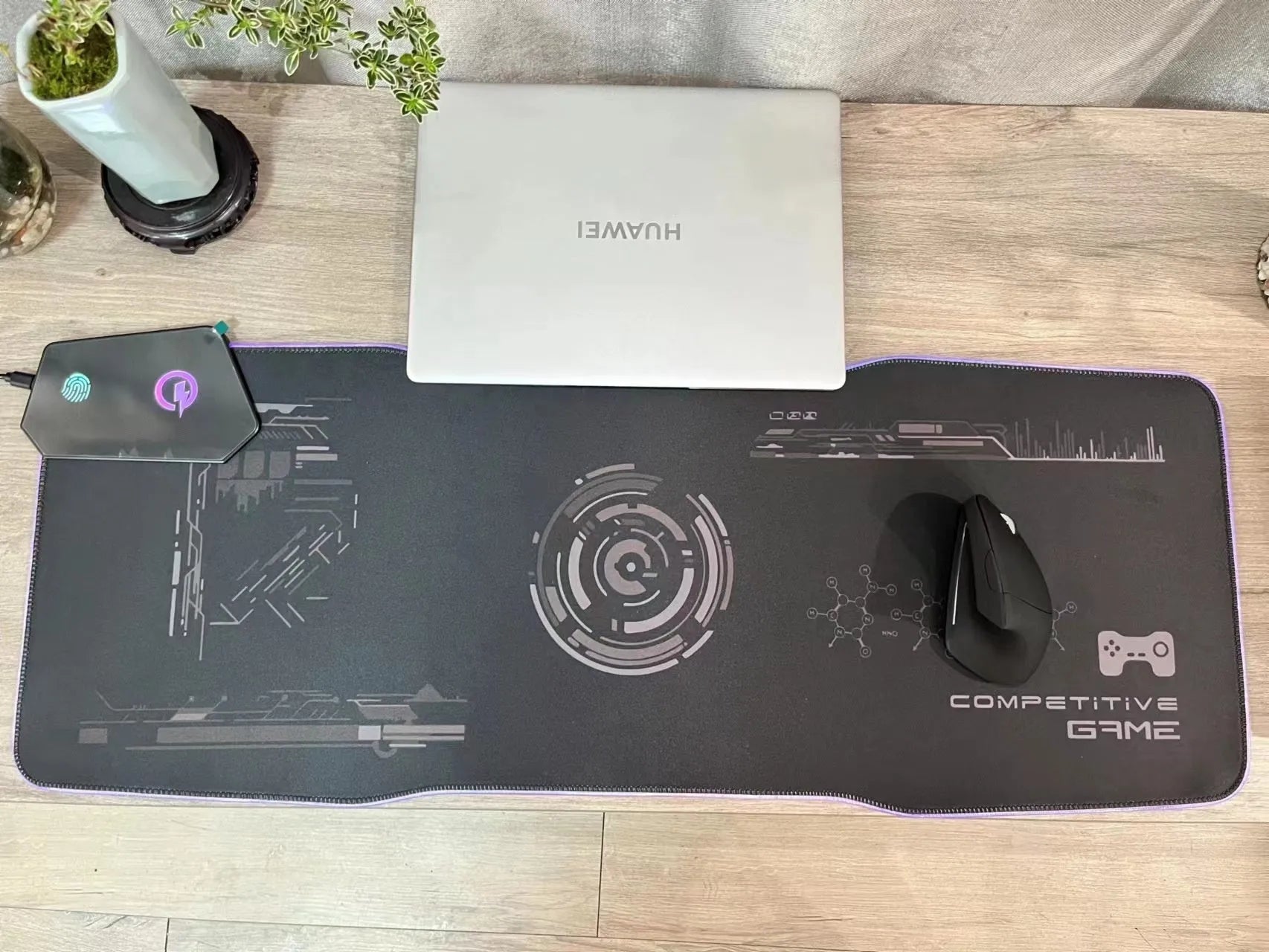 Black mech style gaming mouse mat showing luminous elements and a TYPC interface port on a large 300x800mm surface.