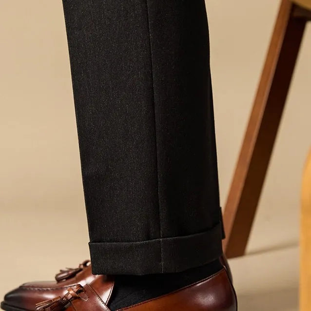 British-style leather tassel loafers in black or brown with polished uppers and traditional tassel detailing