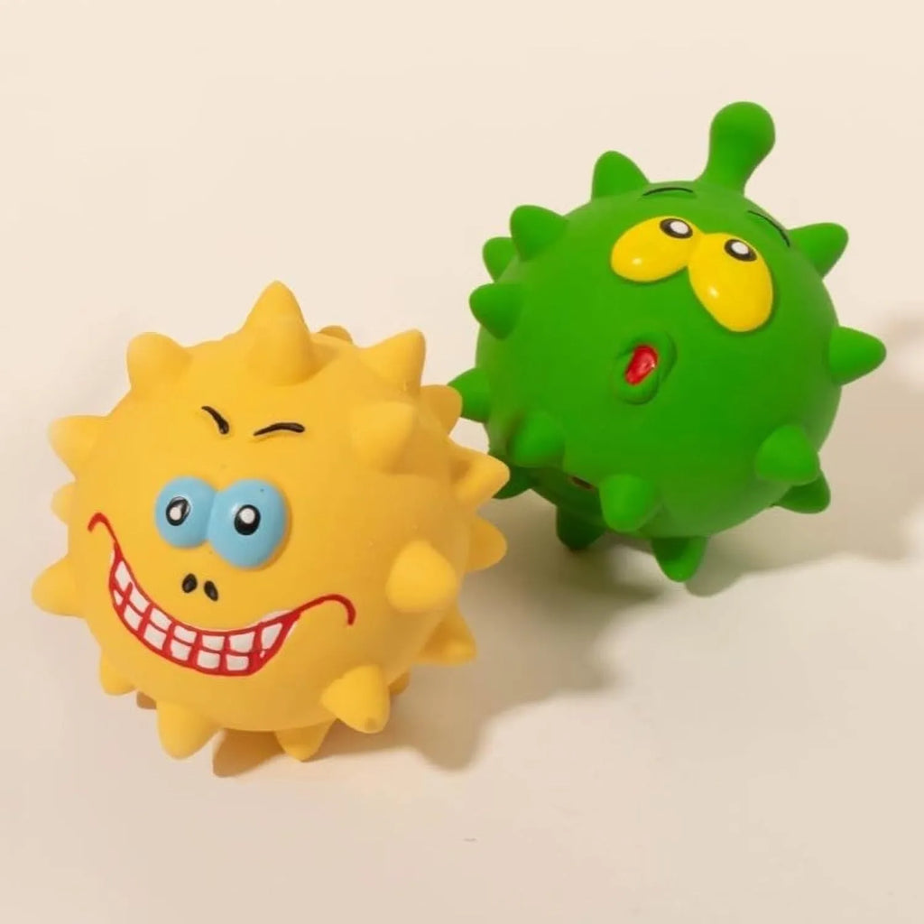 Set of four colourful squeaky dog balls with cute faces, made from natural latex rubber.