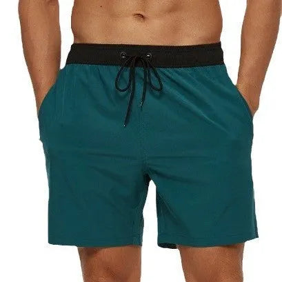 Men's blue stitching waist drawstring shorts with a zipper pocket on the leg.