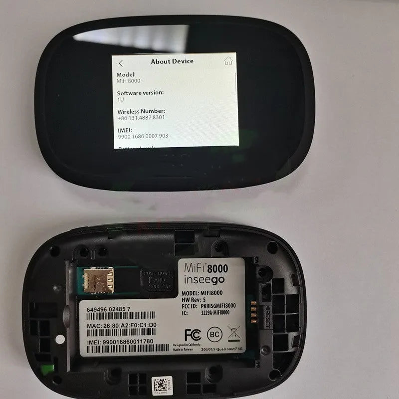 Black mifi8000 4G portable WiFi router with removable battery on a table