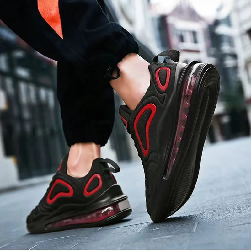 Men's black casual sneakers with lace-up front and thick sole.