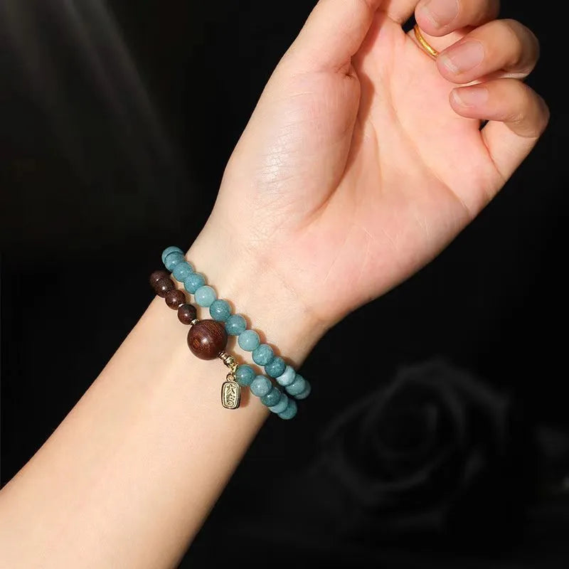 Blue New Chinese style beaded bracelet for women with Fu and Xi characters.
