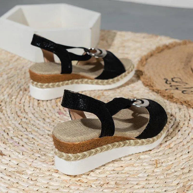 Women's peep toe serpentine wedge sandals, PU upper, in dark brown, shown on foot