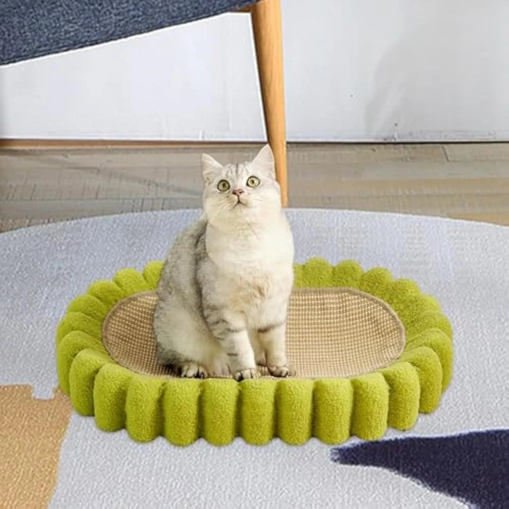 Green oval cat scratcher pad with sisal material and integrated cat bed bowl design