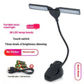 Rechargeable black music stand lamp with 28 LEDs and a USB cable.