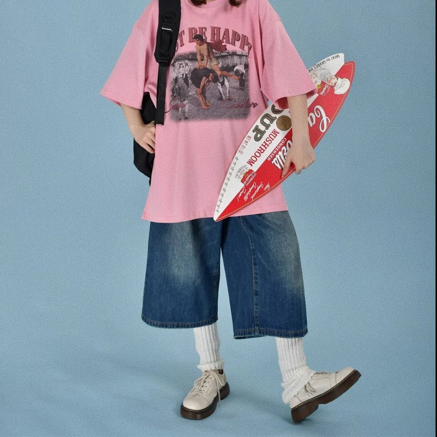 Men's loose fit straight leg denim shorts in blue, shown at a fifth pants length.