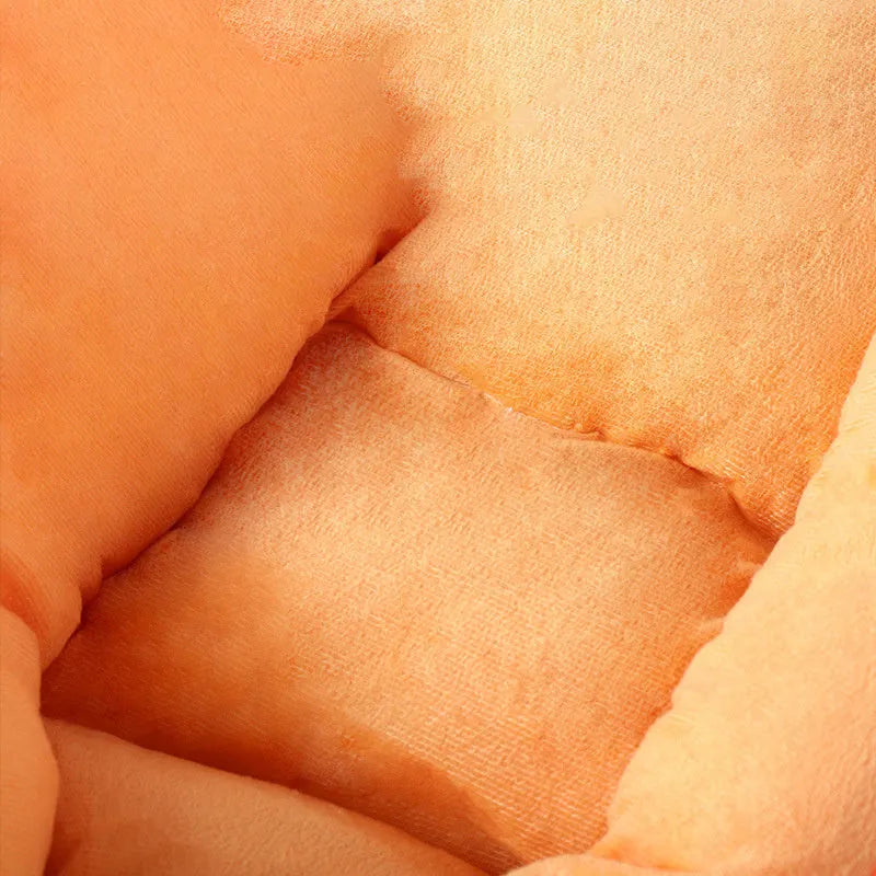 Carrot-shaped enclosed dog nesting bed with a soft blanket, shown in medium and large sizes.