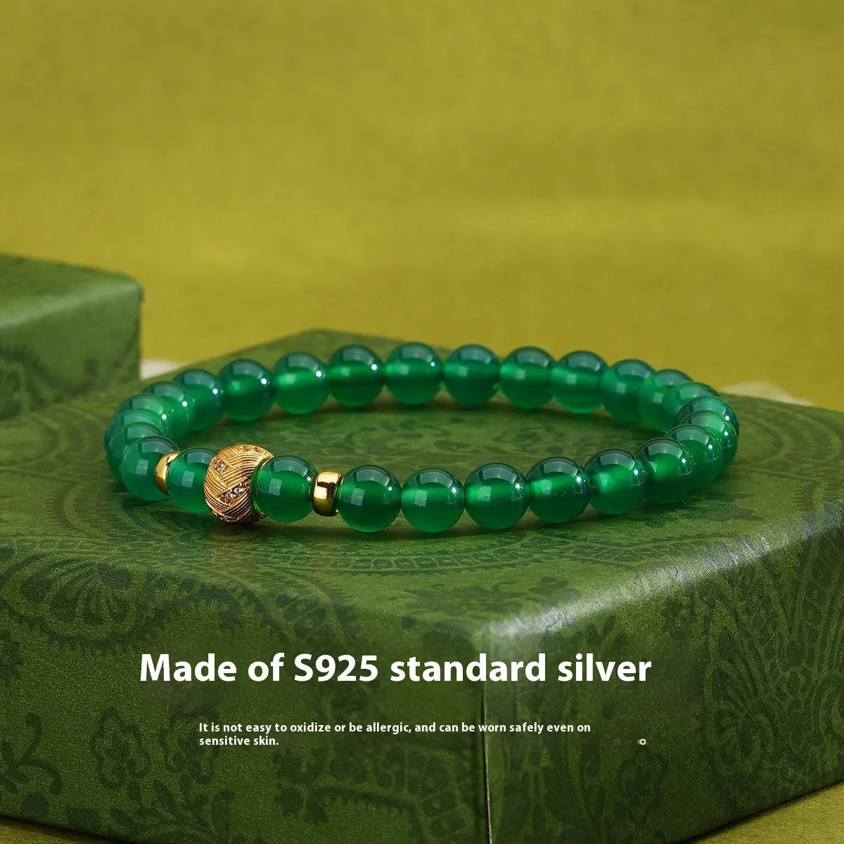Green agate and sterling silver bracelet with yellow gold plating and 6mm geometry beads.