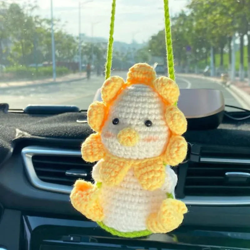 Green and white knitted wool car plant decoration with basin base and hanging rope