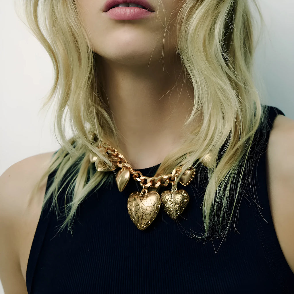 Exaggerated carved heart-shaped alloy pendant necklace on an adjustable metal chain.