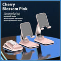 Folding portable desktop phone stand with weighted base in four colour options