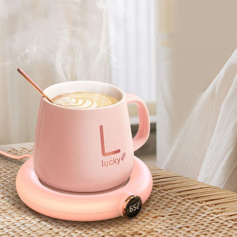 White USB coffee mug warmer plate on wooden desk with measurement showing 130x110mm dimensions