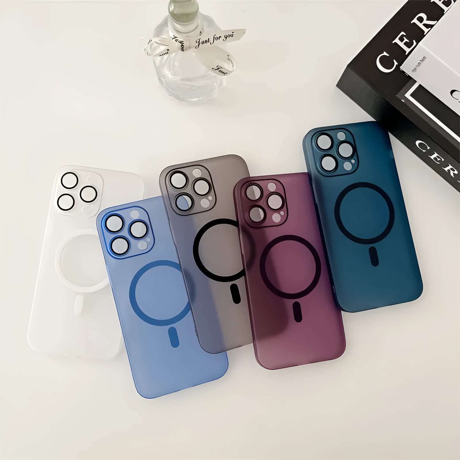 Ice Mist coloured magnetic frosted all-inclusive case for Apple iPhone on a table.