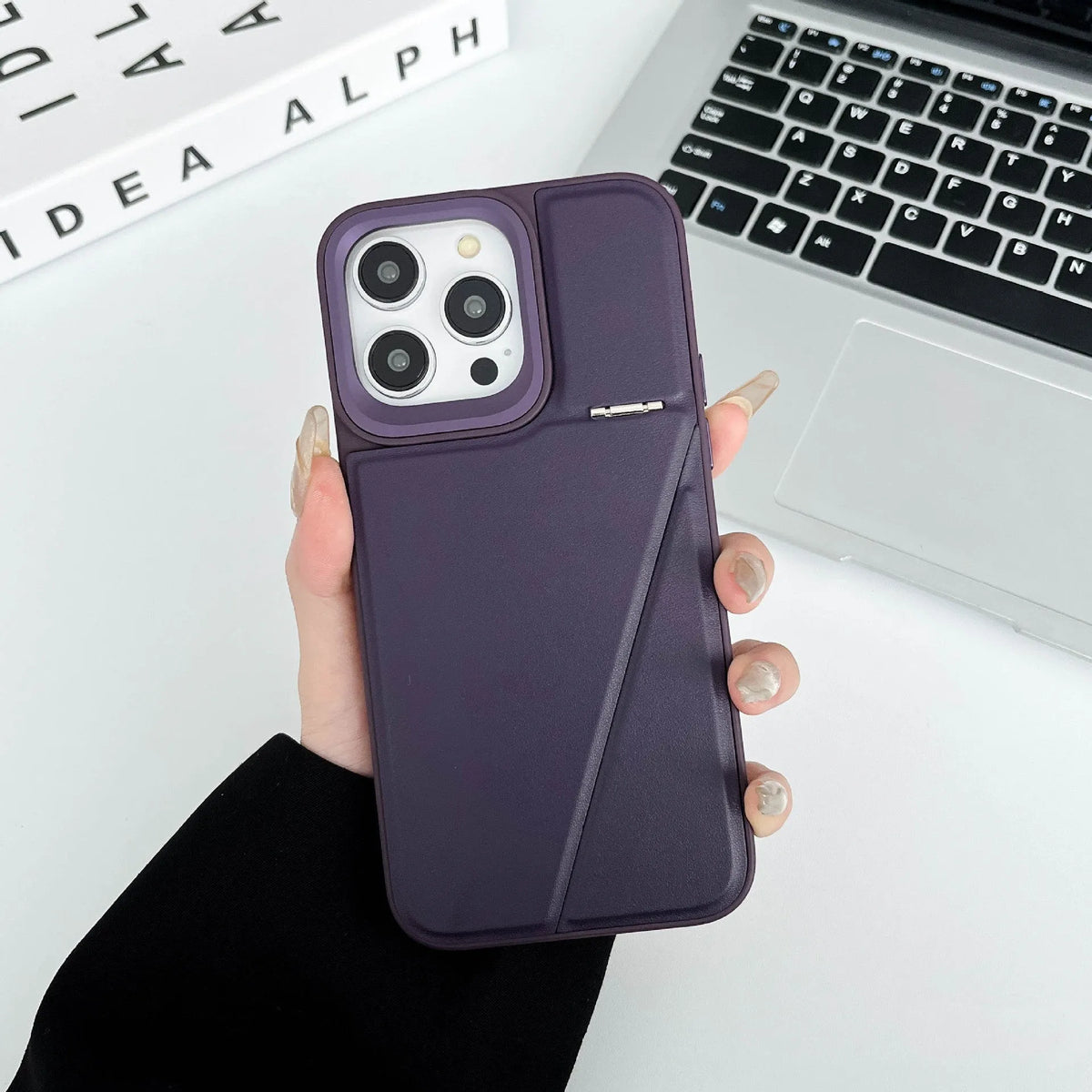 Leather hidden bracket phone case in black for Apple iPhone, featuring magnetic suction and shockproof design.