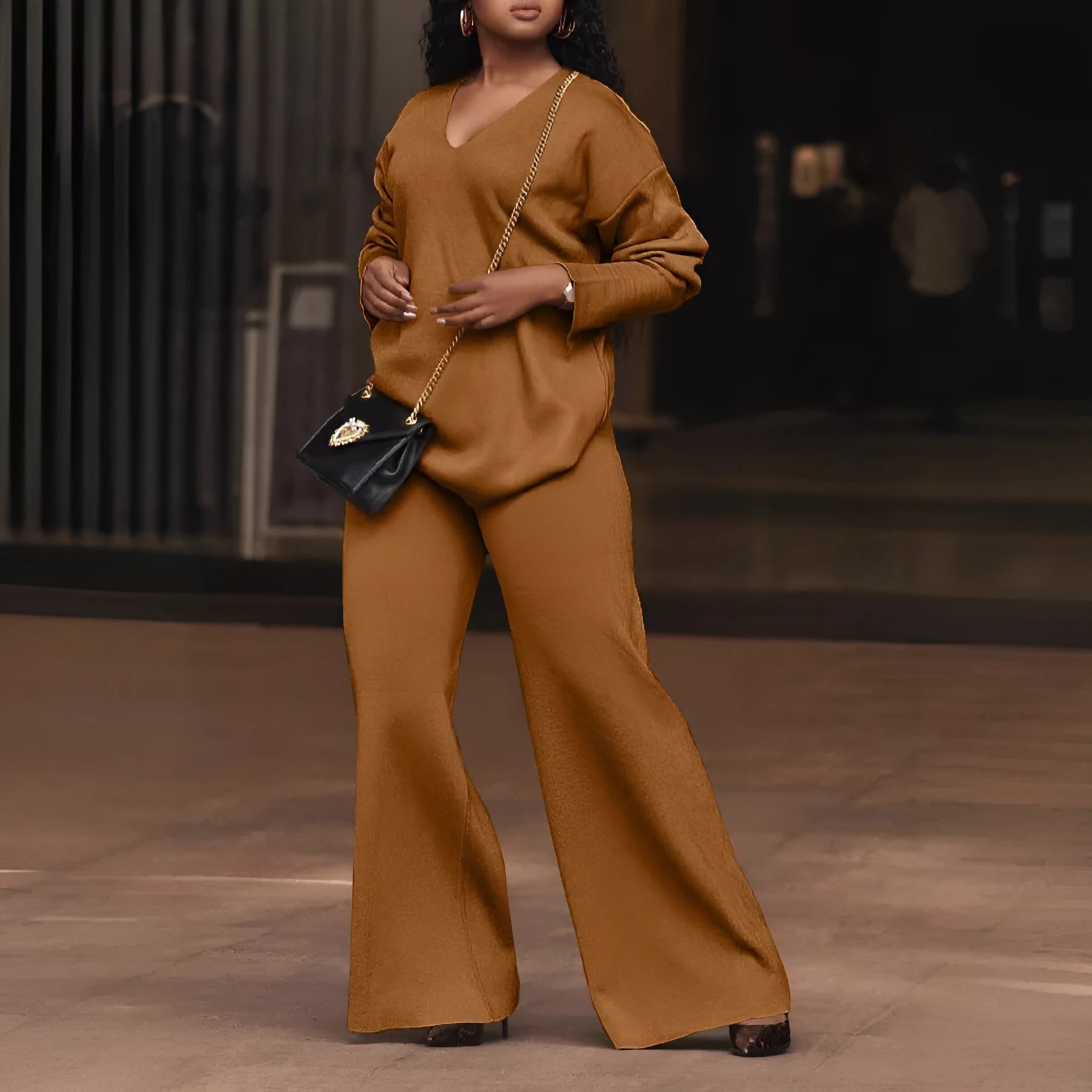 Women's brown thick suede velvet two-piece suit with split long sleeves and matching trousers.