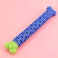 Blue and green silicone dog dental chew toy with serrated brush head and massage nodules.
