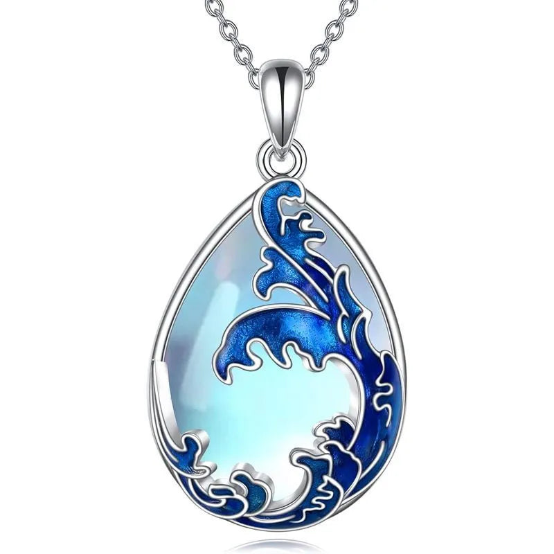 Moonstone blue alloy heart pendant on a women's necklace chain.