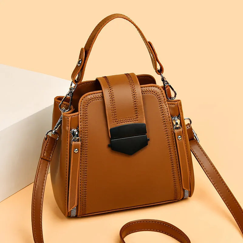 Soft textured PU leather small square handbag for women in multiple colour options showing sewing thread detail.