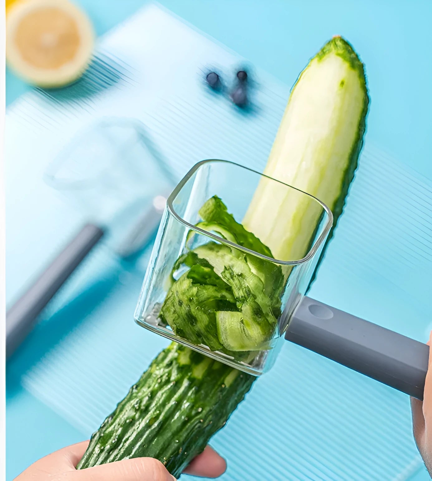 Creative green stainless steel and plastic vegetable peeler on a kitchen surface.