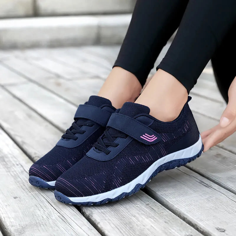 Women's low-top casual shoes with Velcro strap, wedge heel, and breathable mesh upper in a grey purple colour.