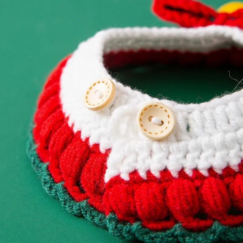 Hand-knitted Christmas cat collar in milk cotton yarn with festive bow design