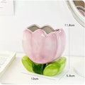 Ceramic pen holder box with floral pattern for desk organisation.