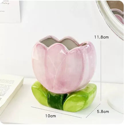 Ceramic pen holder box with floral pattern for desk organisation.
