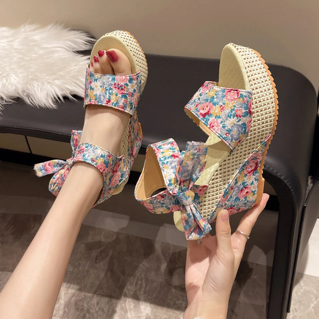 Women's floral wedge sandals with peep toe and ankle strap in pink, black, or blue.