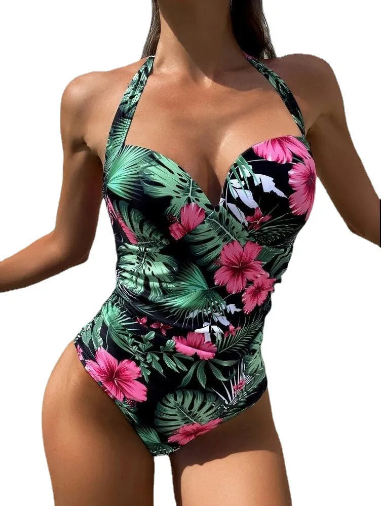 Women's printed one-piece swimsuit with halter neck and backless design in a choice of colours.