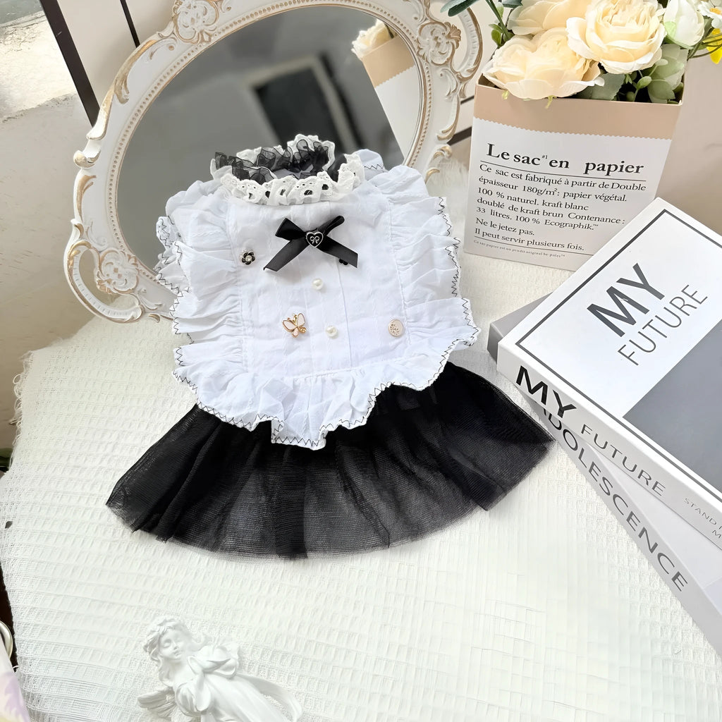 White yarn gauze skirt for small dog on a table, showing princess-style tiered design and lightweight fabric.