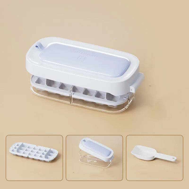 A high-capacity blue ice cube tray with a leverage-action lid and a stored ice shovel.