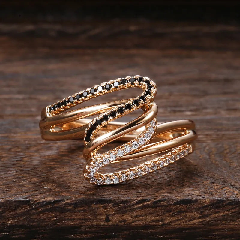 Gold tone women's copper ring with micro-inlaid sparkling zircon stones on a finger.