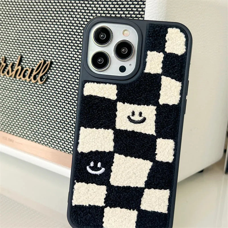 Black and white chessboard TPU phone case for iPhone with precise cutouts on a white background