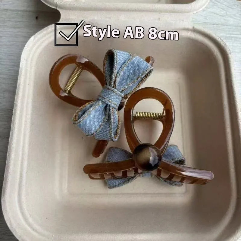 Blue denim bow barrette with cloth bow and metal clip on women back head hair