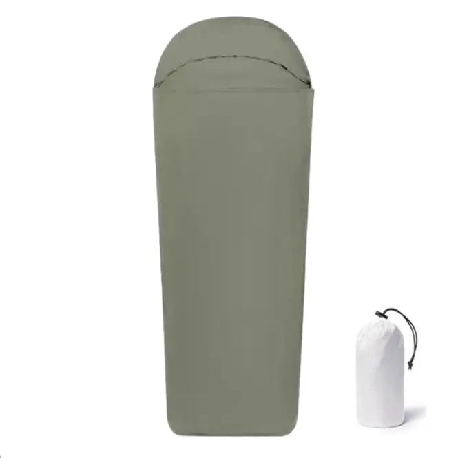 Blue nylon mummy sleeping bag for adults, shown rolled, highlighting its tapered shape and matte plaid fabric texture.