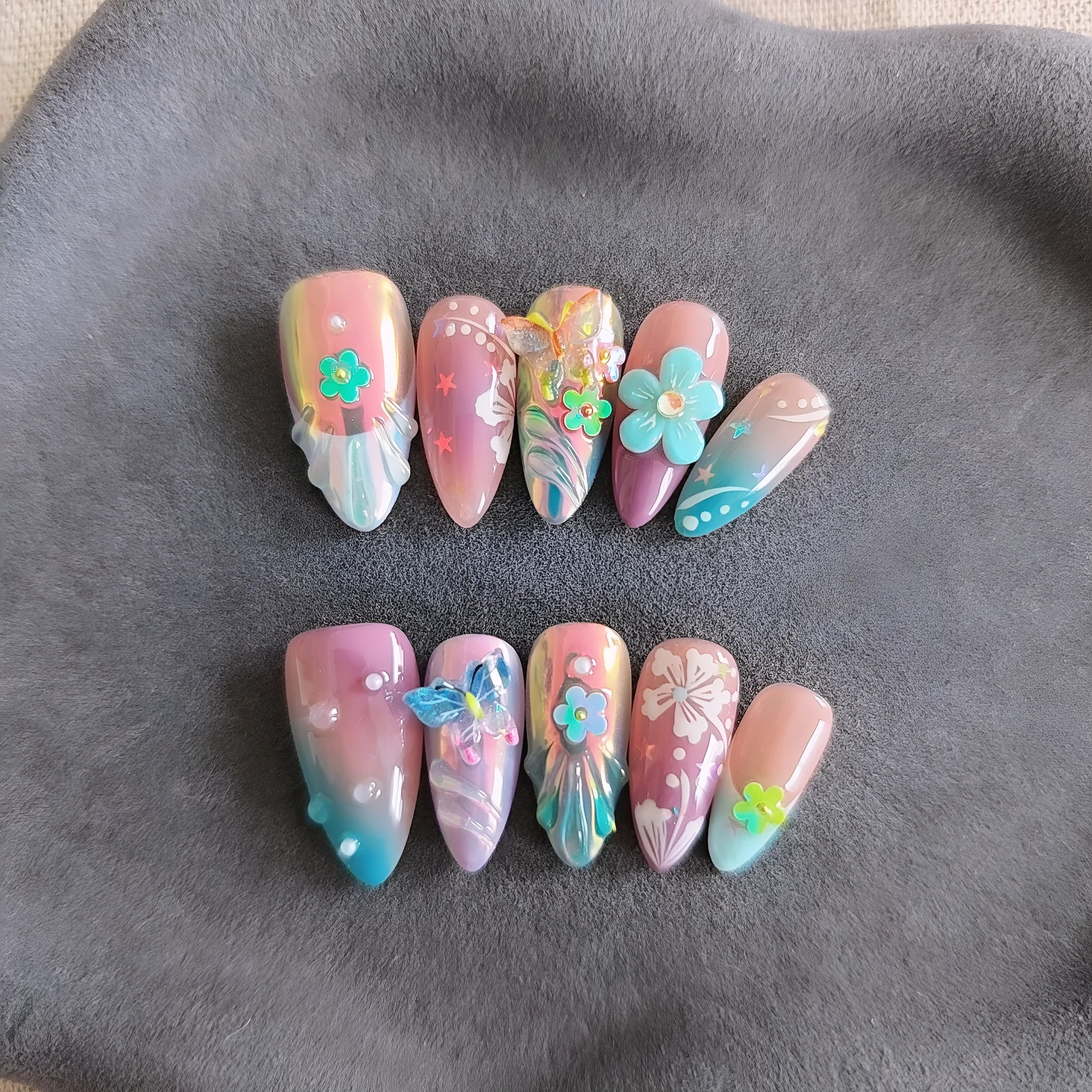Handmade nail art stickers with colourful floral and butterfly embossed designs