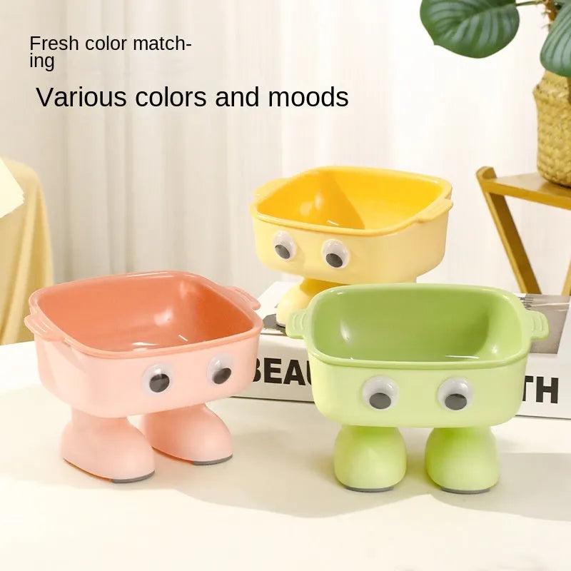 Green robot-shaped elevated cat bowl with tilted design and detachable inner section